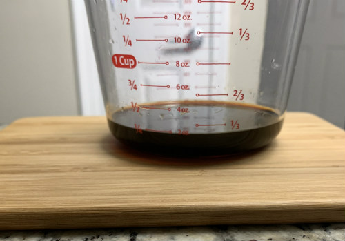 Dark liquid measured in a clear cup