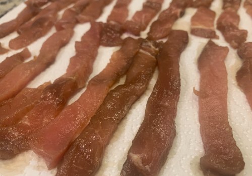 Marinated pork strips laid separately on paper towels
