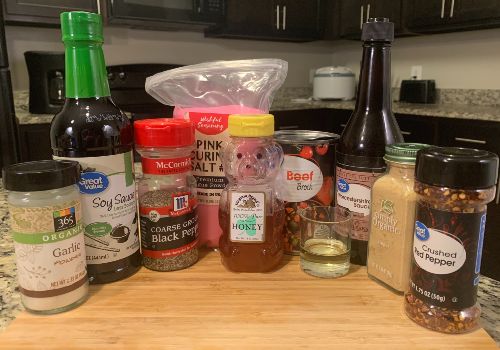 Honey, beef broth, sauces, and ground seasonings for jerky