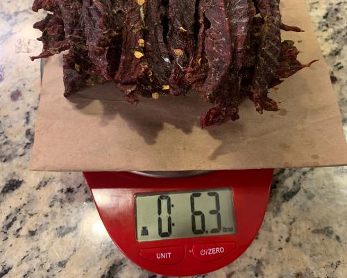 Finished jalapeno jerky on a scale reading 6.3 ounces