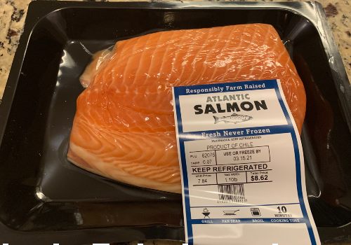 Packaged Atlantic salmon fillet on a kitchen counter