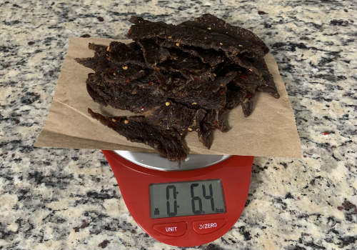 Finished jerky on a scale reading 6.4 ounces