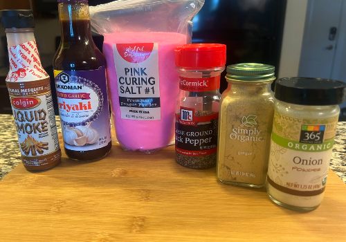 Teriyaki sauce, liquid smoke and jars of seasonings