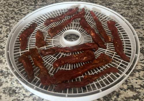 Beef jerky placed on the dehydrator