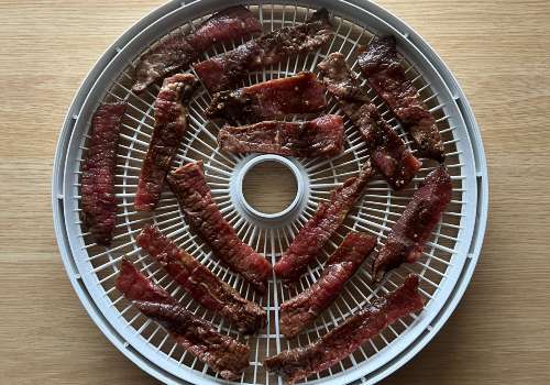 Beef is placed on the dehydrator for drying
