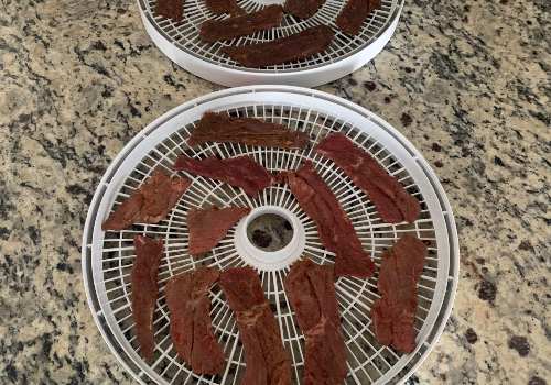 Beef placed on the dehydrator for drying