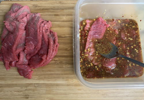 Mixing the marinade and the meat for beef jerky