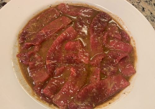 Mixing marinade and meat for brown sugar beef jerky