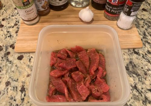 Mixing the marinade and meat for Keto beef jerky