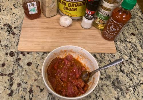 Mixing marinade and meat for Sweet heat sriracha jerky