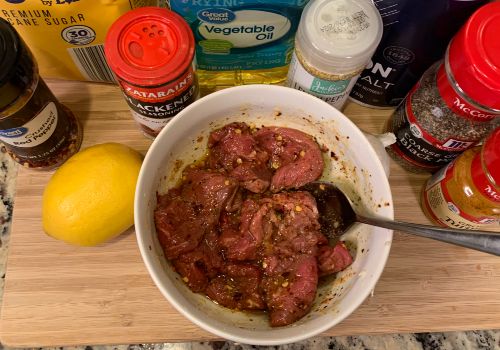 Mixing the marinade and meat for Vietnamese beef jerky recipe