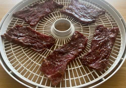 Our beef placed on the dehydrator