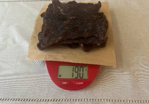 Weighing our beef jerky after cooking