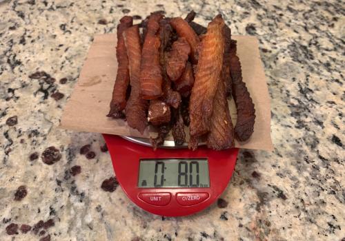 Weighing salmon after cooking in oz.